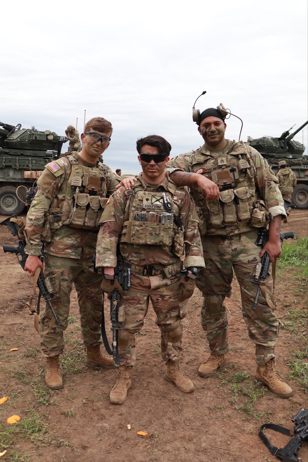 Three soldiers standing together in Ełk, Poland
